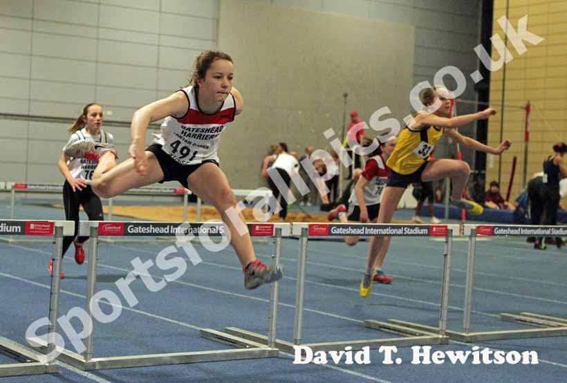 Lauren Beales (Gateshead Harriers) winning the under-13 girls 60 metres hurdles.